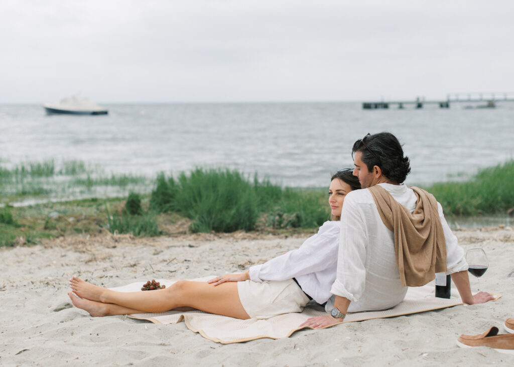 Beautiful couple relaxing on the beach in Southport at golden hour