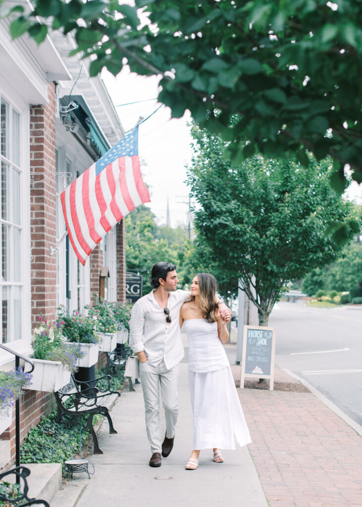 gorgeous couple walking down Pequot Avenue in downtown Southport, CT